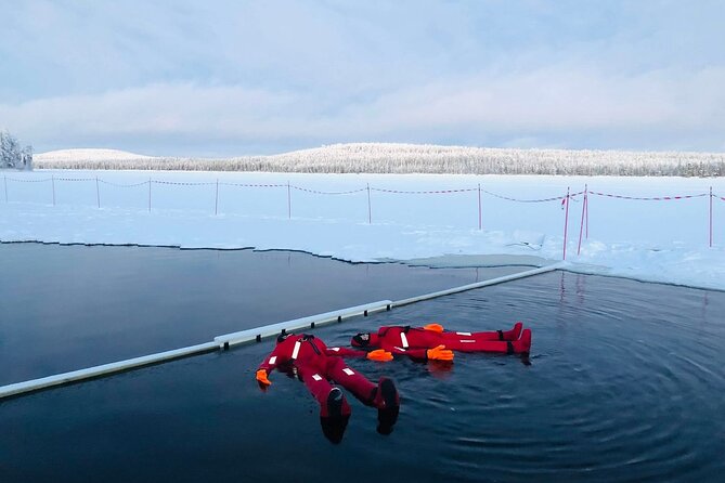 Arctic Day with Ice Fishing and Floating - Ice floating in a thermal suit