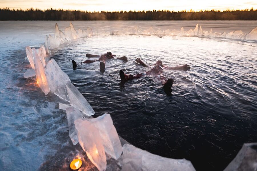 Daytime Ice Floating Rovaniemi, Frozen Lake Experience - The cottage, open fire, and hot berry drink