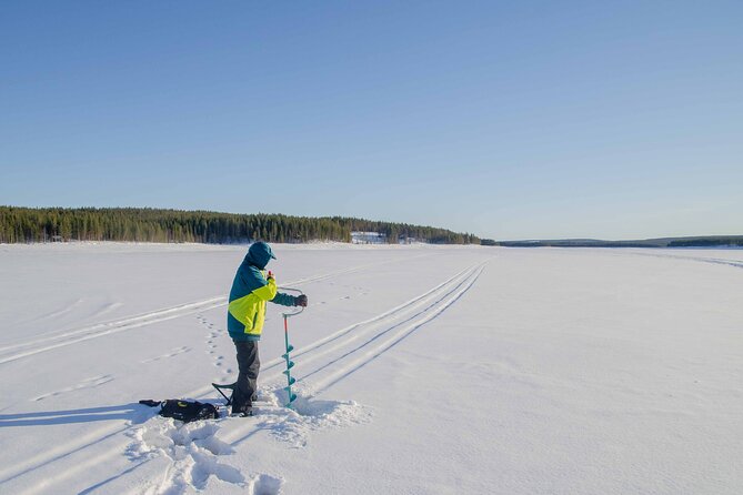 First Ice Fishing Experience in Rovaniemi - Learning to drill through the ice