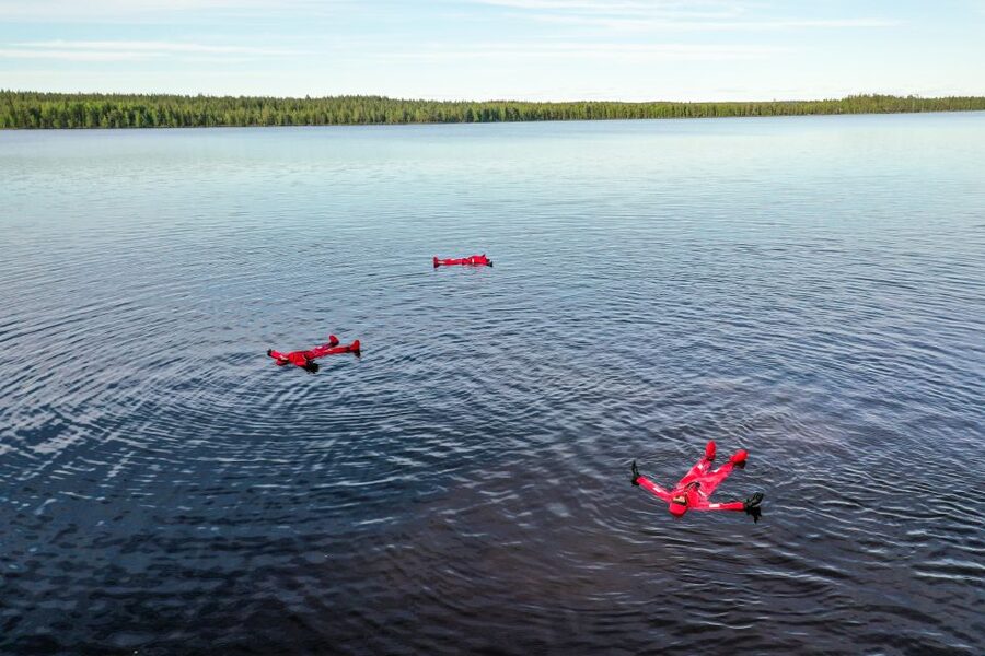 From Rovaniemi: Midnight Sun Forest Lake Float - A short walk with local stories