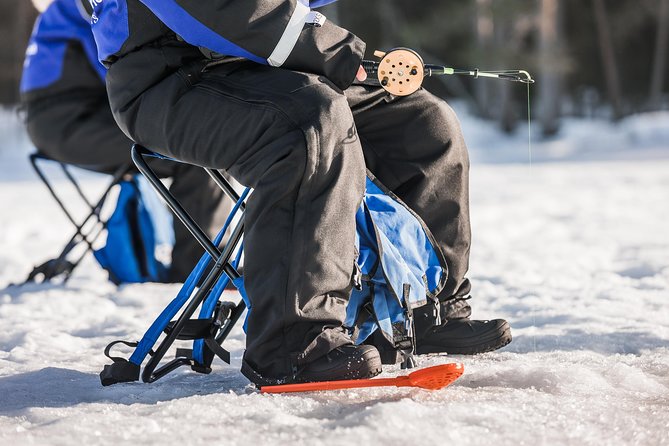 Ice Fishing Tour - Drilling through the ice