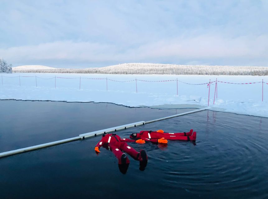 Lapland: Ice Fishing, Floating & BBQ Snow Adventure - Learning the patient art of ice fishing