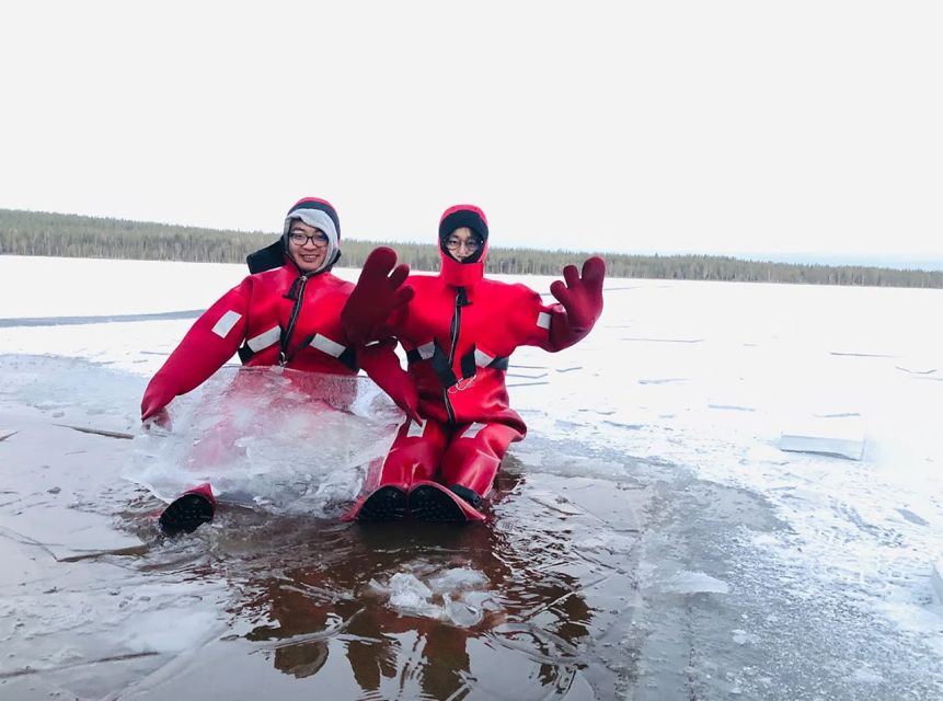 Lapland: Ice Fishing, Floating & BBQ Snow Adventure - Floating in a survival suit