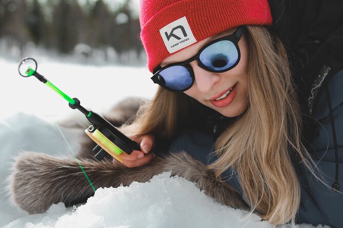 Lappish Lunch Break -Snowmobiling, ice fishing and tasty food - Why the Extra-Warm Clothing Matters
