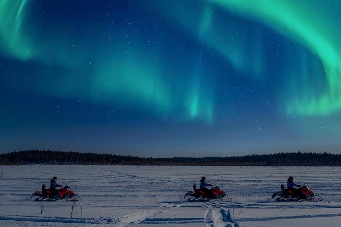 Night Snowmobile Safari, Rovaniemi - Snowmobile trails under a dark sky