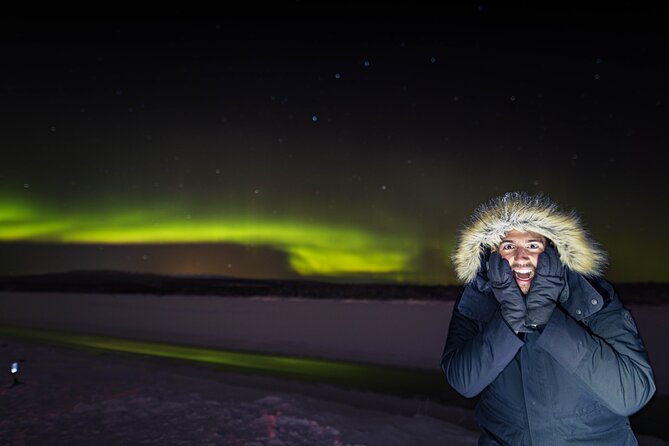 Northern Lights Tour with BBQ and drinks - A campfire, sausages, and hot drinks by the ice