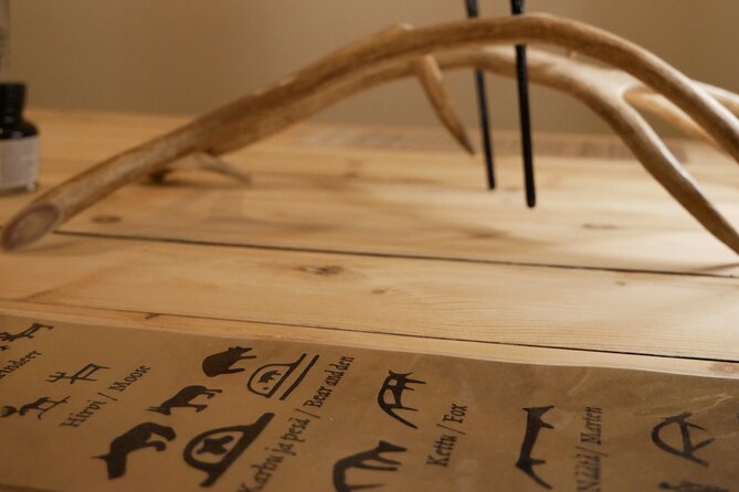 Reindeer Antler Workshop - Crafting reindeer antler in a candlelit Lapland room