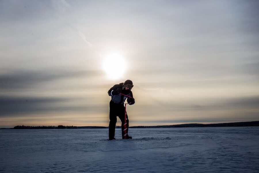 Rovaniemi: Ice Fishing on a Frozen Lake with BBQ and Photos - Reaching the campsite after the short walk