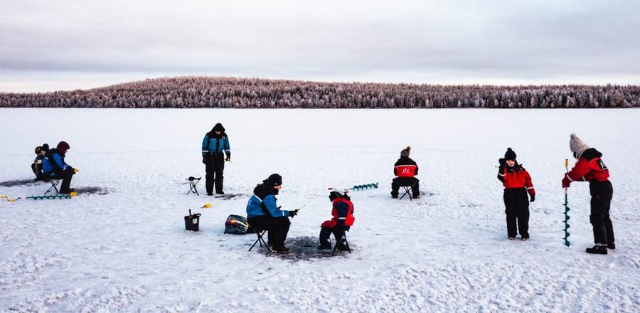 Rovaniemi: Quad Bike Ride and Ice Fishing - Salmon by the fire