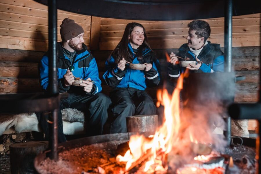 Rovaniemi: Snowmobile and Ice Fishing Adventure with Lunch - Drilling an ice-fishing hole by hand