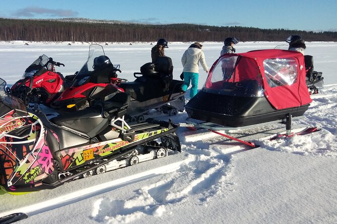 Snowmobile and Ice Fishing Excursion (private tour) - Riding across frozen water and snowy forest