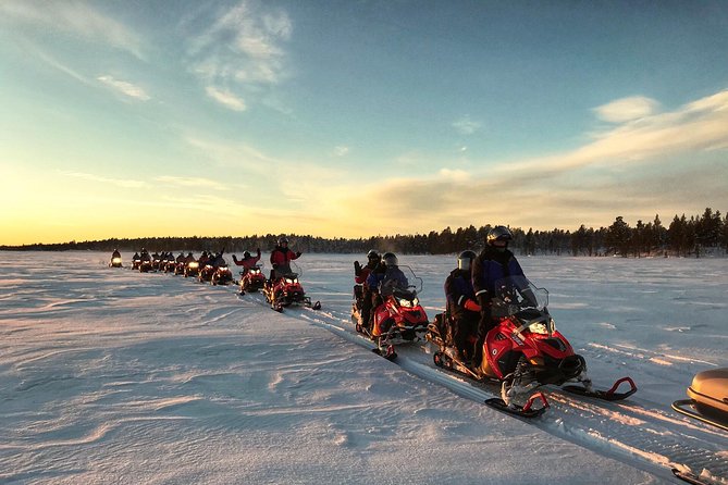 Snowmobile Safari 2h - Crossing the frozen river on a two-person snowmobile