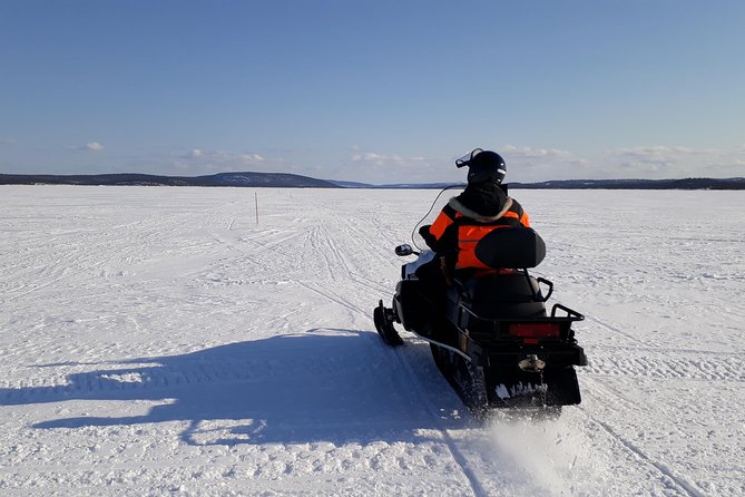 Snowmobile Safari to Lake Inari, meet & feed Reindeers, Lunch - A small island, a teepee, and three reindeer