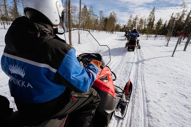 Snowmobiling and ice fishing in Apukka Resort, Rovaniemi - Reaching the frozen pond for ice fishing