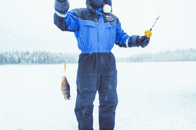 Snowmobiling and ice fishing in Apukka Resort, Rovaniemi - Bonfire warmth, hot drinks, and a simple snack