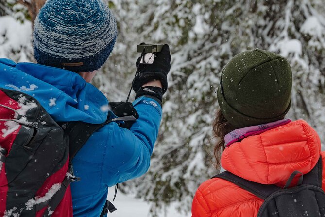 Snowshoeing Adventure with Ice-Fishing, Fire and Survival - Drilling through the frozen lake