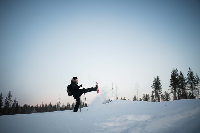 Wilderness snowshoe adventure - The wooden shelter and campfire break
